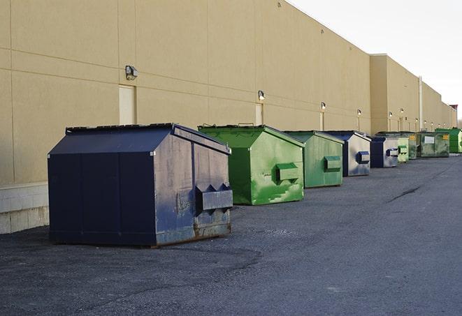 large construction dumpster positioned on a city street in Danville, OH